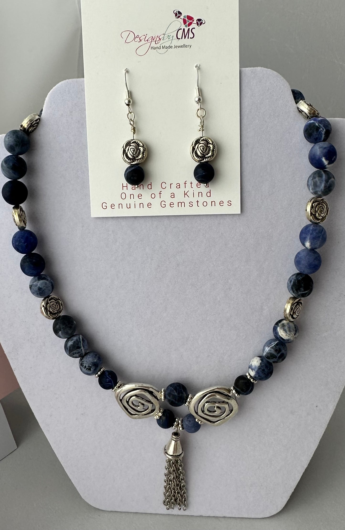 DISTINCTIVE TASSELED HARMONY DESIGN