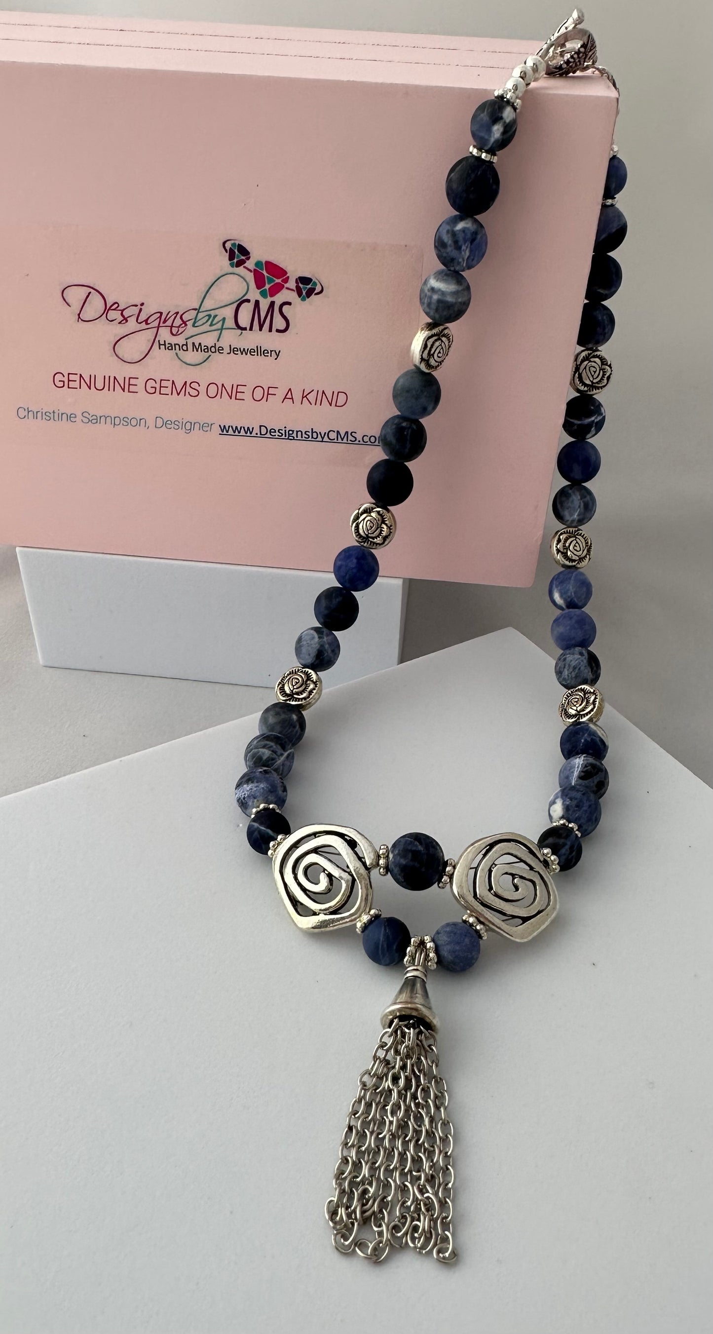 DISTINCTIVE TASSELED HARMONY DESIGN