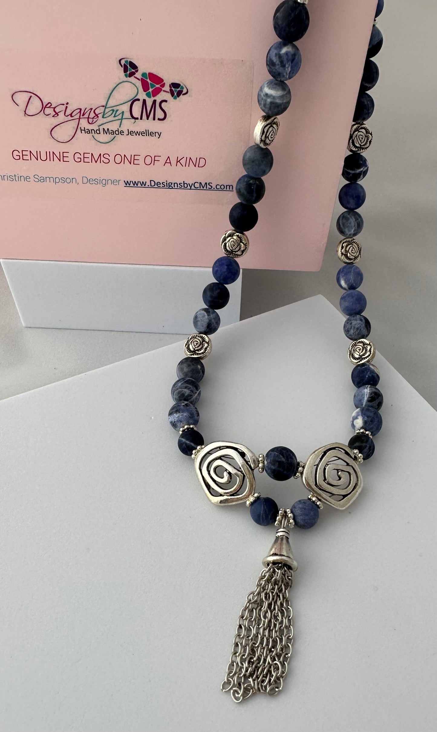 DISTINCTIVE TASSELED HARMONY DESIGN